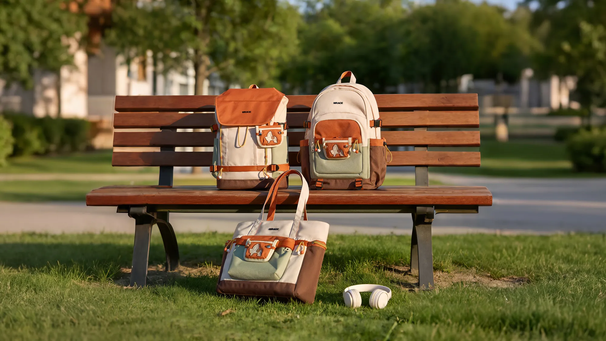 Mr.ace Homme bags on a park bench